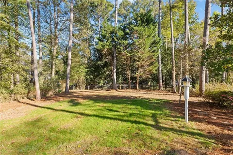 front view of a house with a tree