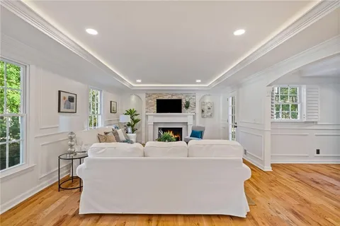 a view of a livingroom with furniture and wooden floor