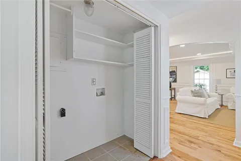 a kitchen with stainless steel appliances granite countertop white cabinets and a stove