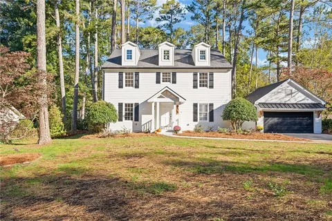 a view of a playground with basketball court