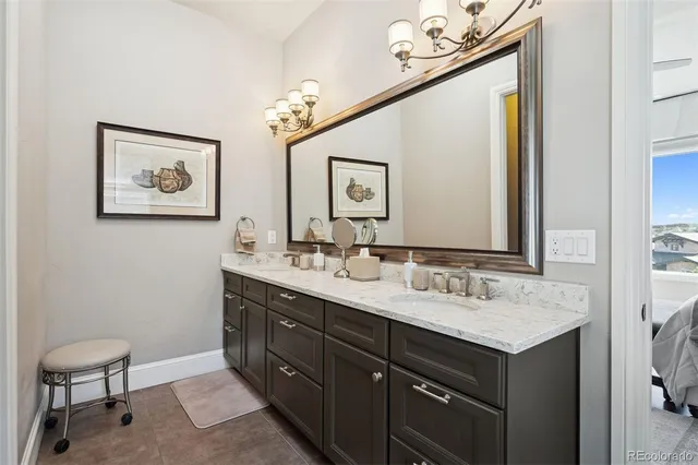 a bathroom with a sink vanity and a mirror
