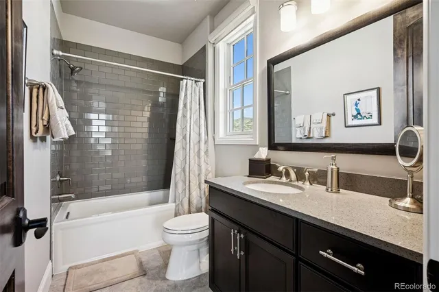 a bathroom with a sink a toilet and a bathtub