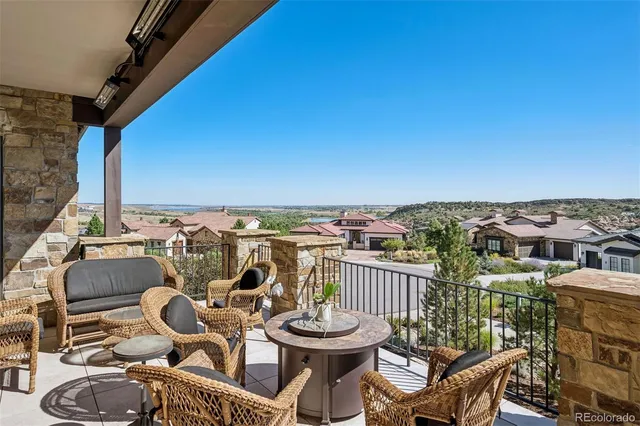 a view of a balcony with chairs