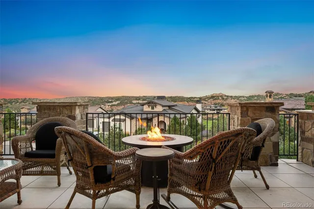 a view of a chairs and table in patio