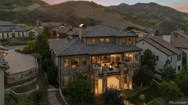 a view of a patio with table and chairs and potted plants