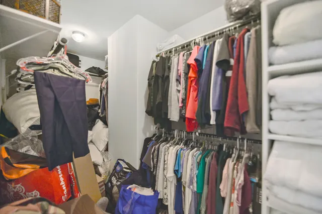 a bedroom with furniture and a chandelier