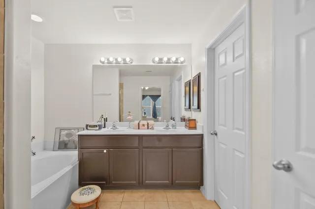 a view of a workspace with furniture and a book shelf