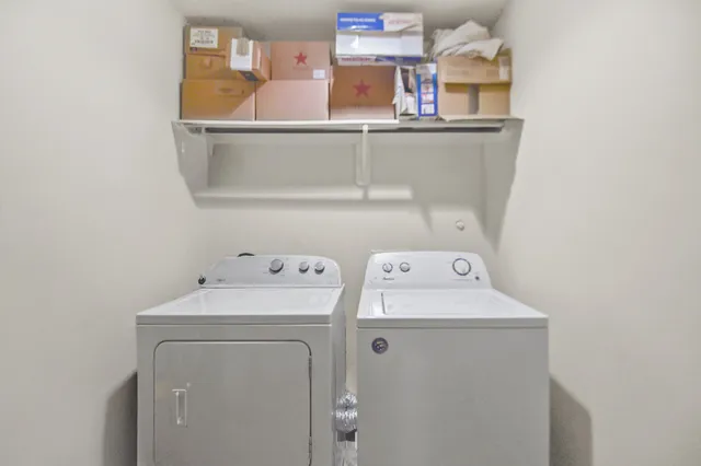 a view of a backyard with wooden fence