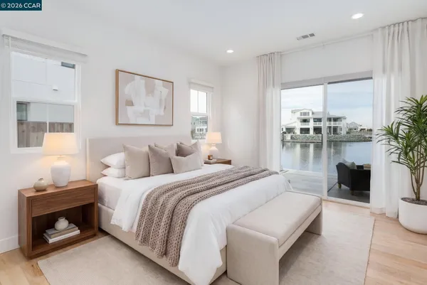 a bedroom with bed and a couch