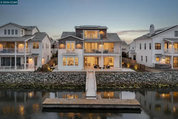 a front view of a building with lake view and chair