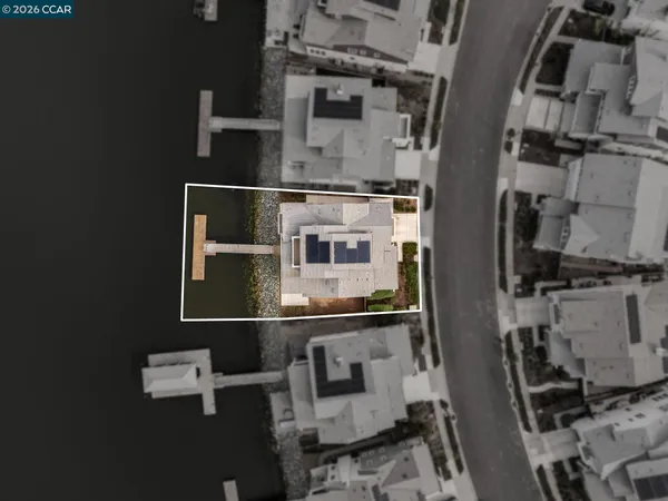 an aerial view of a house with parking space