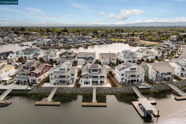an aerial view of residential houses with parking