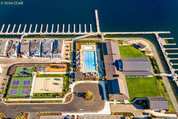 an aerial view of residential houses with outdoor space
