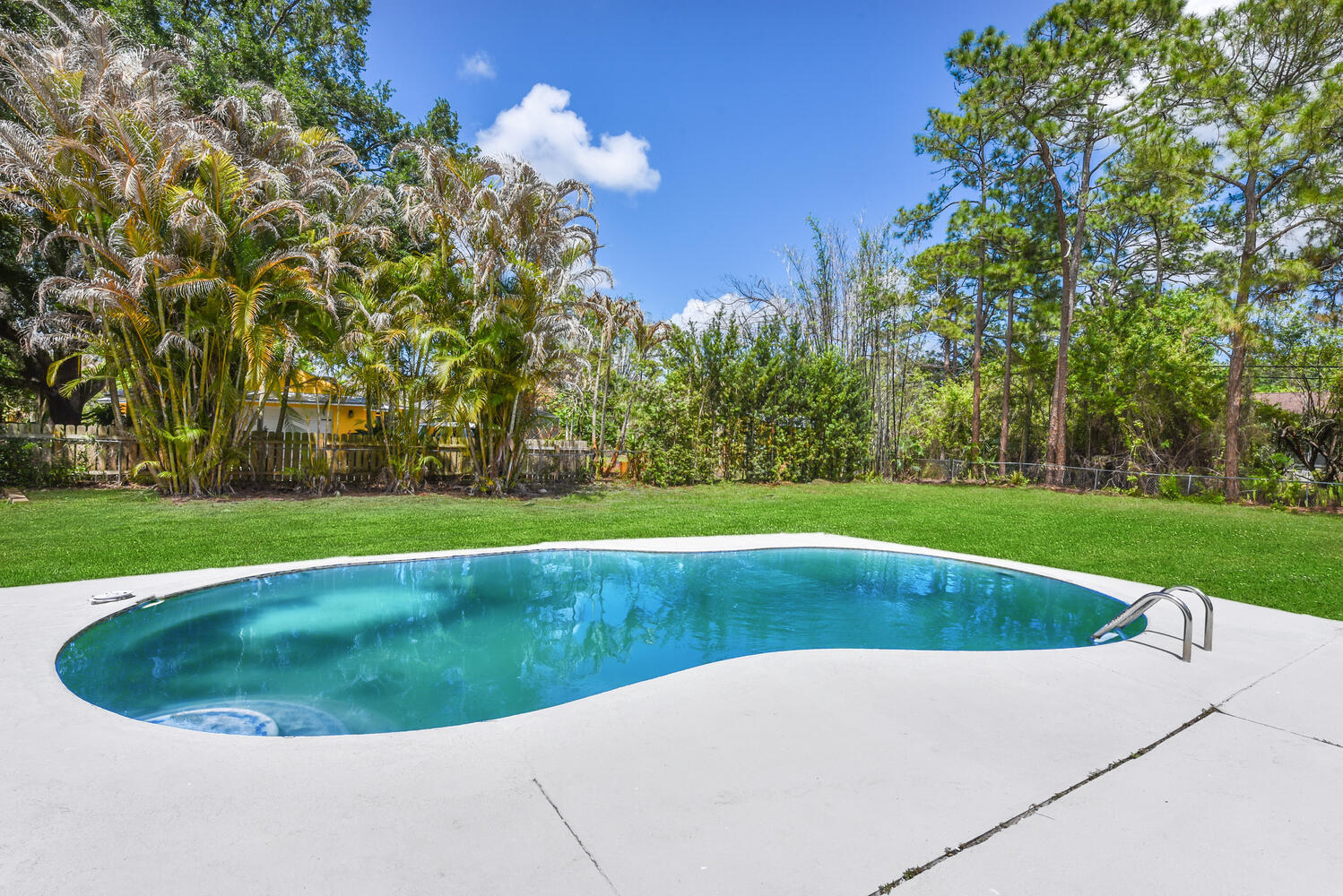 8587 Southwest 18th Avenue Stuart, FL 34997 - Photo 29 of 39 a view of outdoor space yard and swimming pool