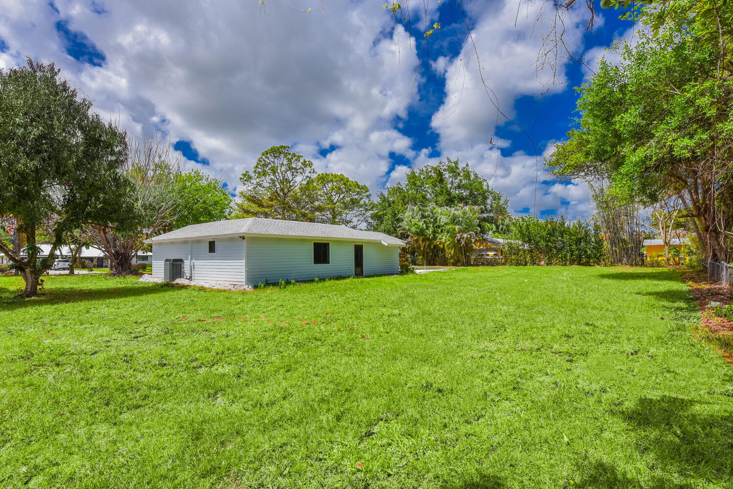 8587 Southwest 18th Avenue Stuart, FL 34997 - Photo 30 of 39 a view of a house with a yard