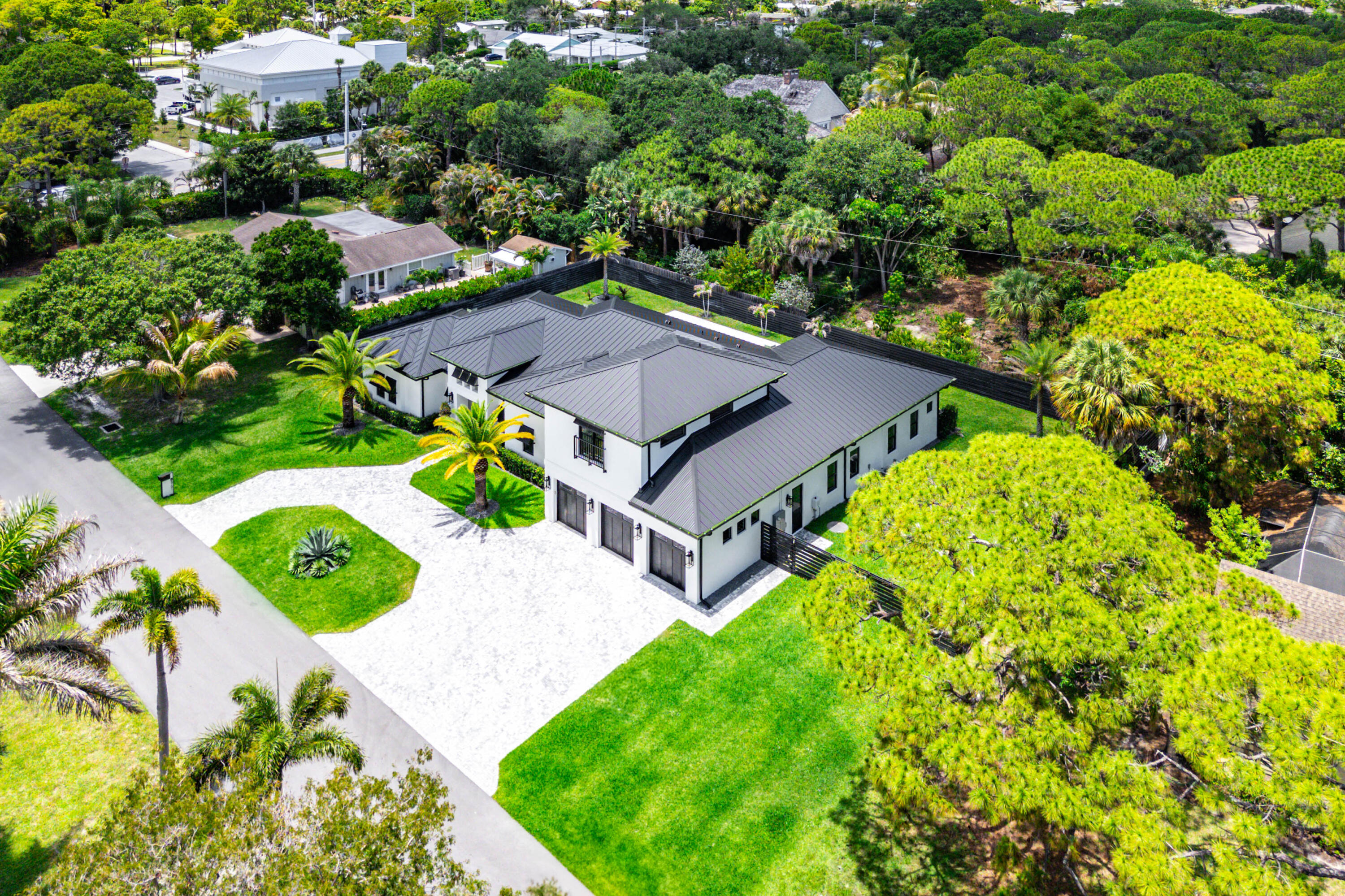5701 Old Orange Road Jupiter, FL 33458 - Photo 41 of 46 an aerial view of a house with garden space and street view