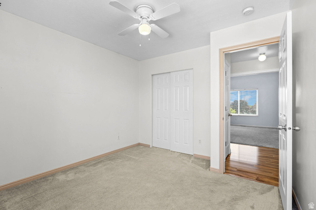142 East 2675th Street South Clearfield, UT 84015 - Photo 26 of 49 Carpeted room featuring a ceiling fan with light fixture and bifold closet doors