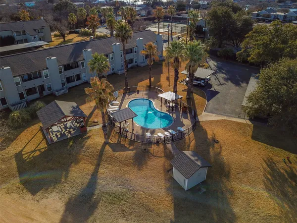 an aerial view of a house with a lake view