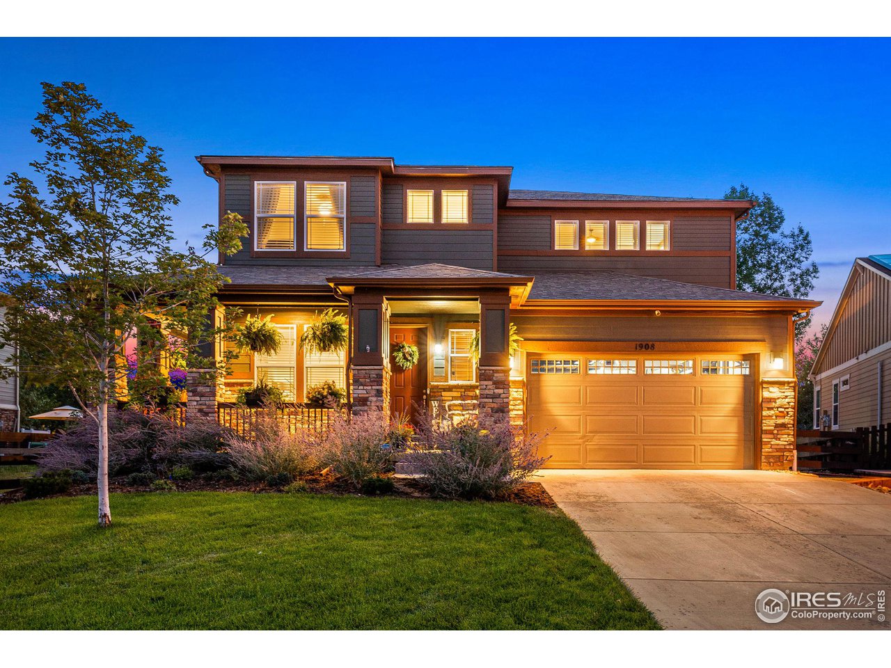 1908 Pioneer Circle Lafayette, CO 80026 - Photo 1 of 40 a front view of a house with a yard