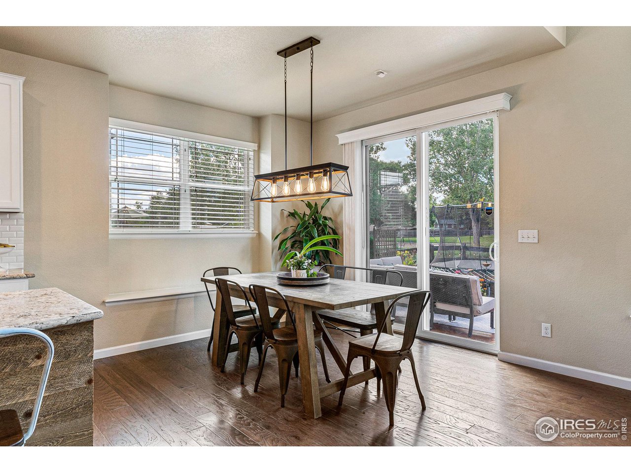 1908 Pioneer Circle Lafayette, CO 80026 - Photo 11 of 40 a view of a dining room with furniture window and outside view