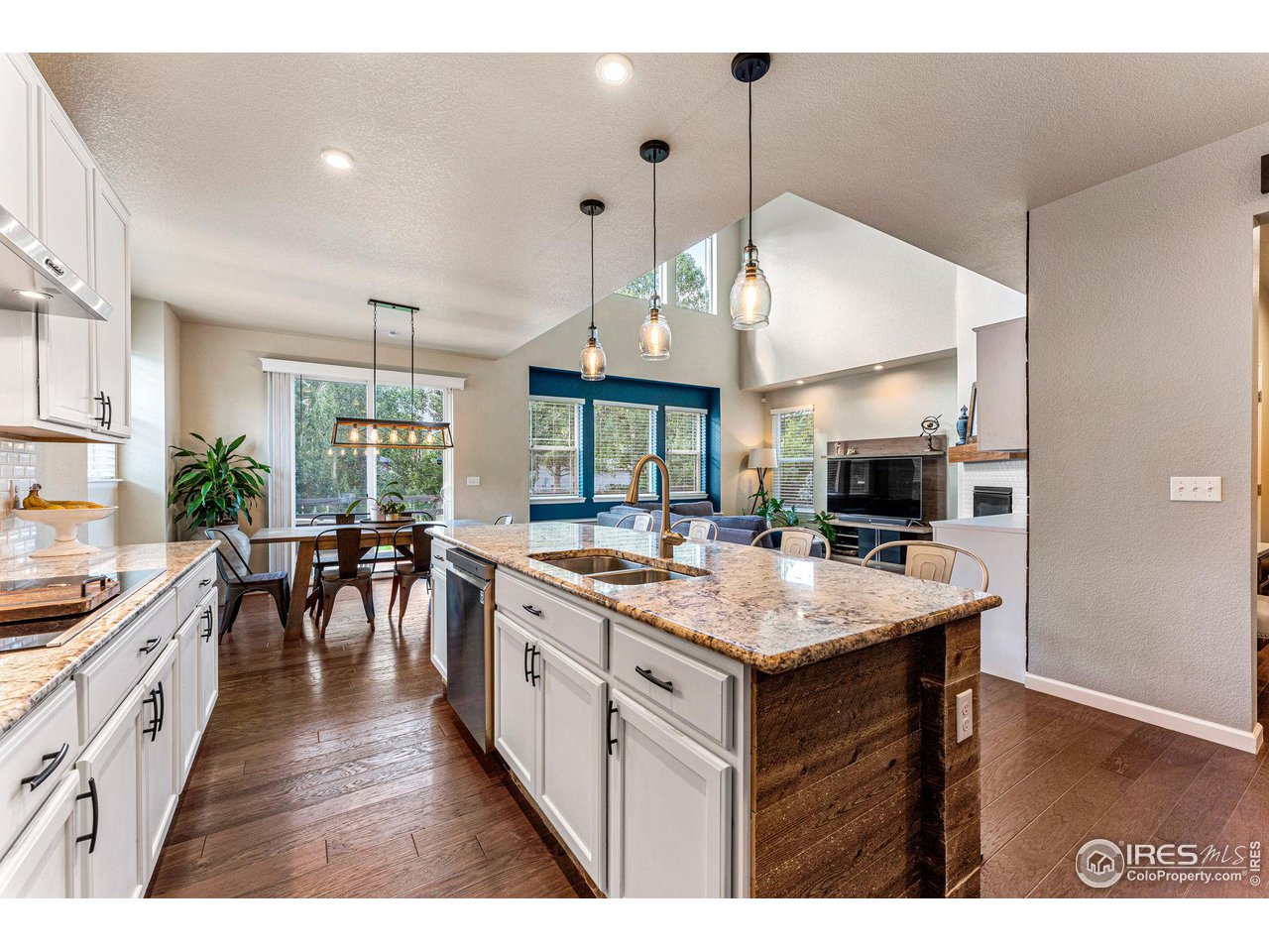 1908 Pioneer Circle Lafayette, CO 80026 - Photo 13 of 40 a kitchen with a stove and a wooden floor