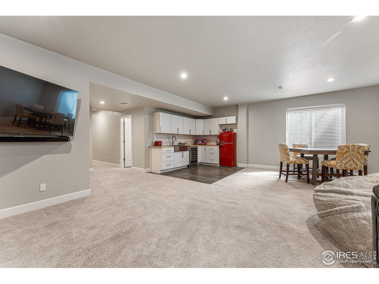 1908 Pioneer Circle Lafayette, CO 80026 - Photo 24 of 40 a living room with furniture and a flat screen tv