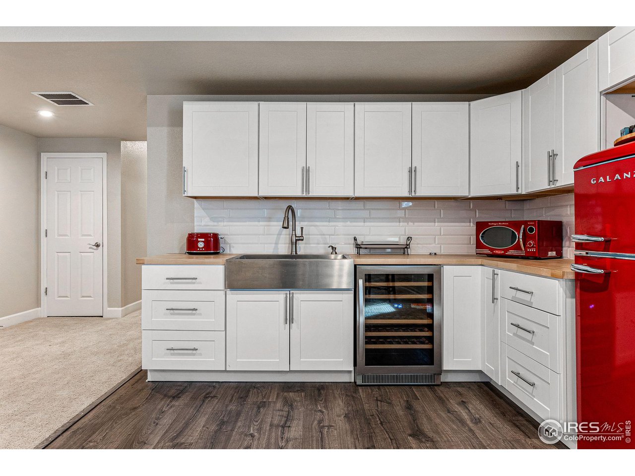 1908 Pioneer Circle Lafayette, CO 80026 - Photo 27 of 40 a kitchen with cabinets appliances and a window