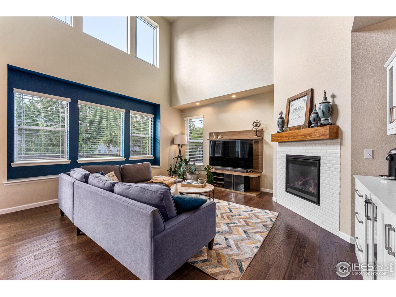 1908 Pioneer Circle Lafayette, CO 80026 - Photo 7 of 40 a living room with furniture large window and a fireplace