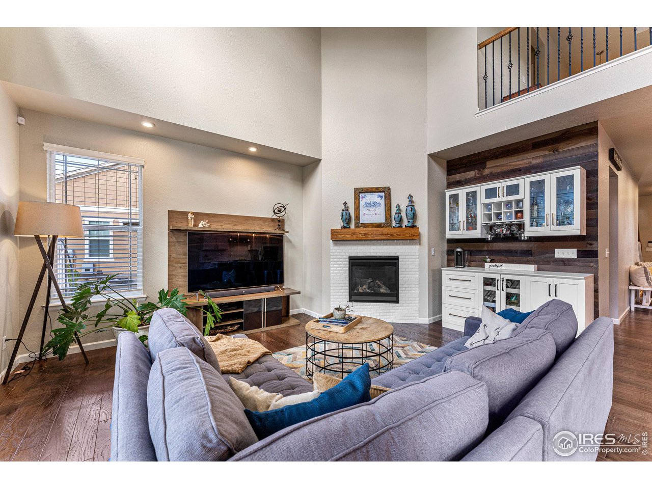 1908 Pioneer Circle Lafayette, CO 80026 - Photo 9 of 40 a living room with furniture and a flat screen tv