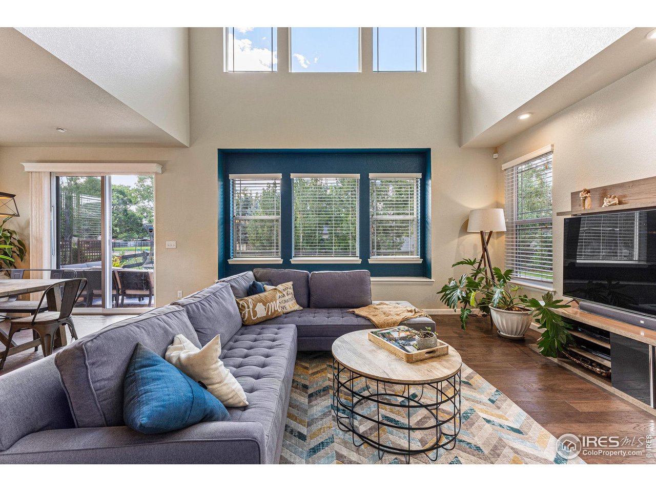 1908 Pioneer Circle Lafayette, CO 80026 - Photo 10 of 40 a living room with furniture flat screen tv and a large window