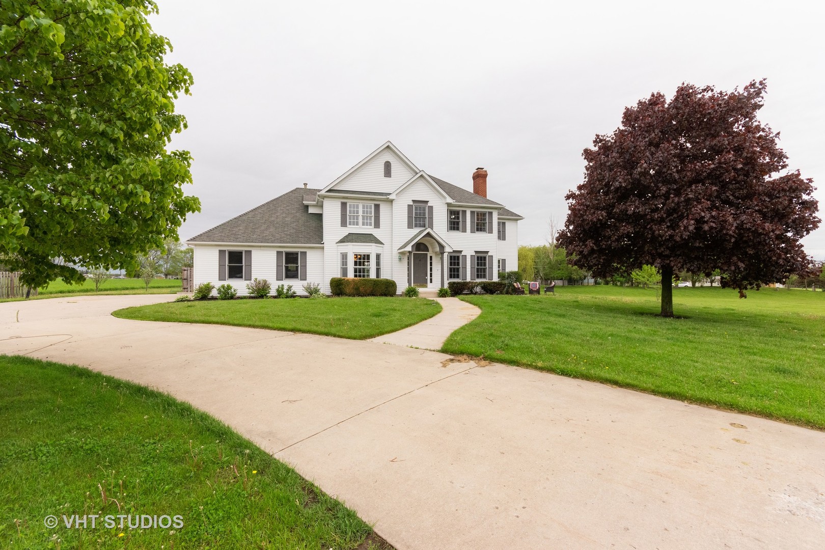 41W910 Verhaeghe Road St. Charles, IL 60175 - Photo 1 of 18 a view of house with a garden and pathway