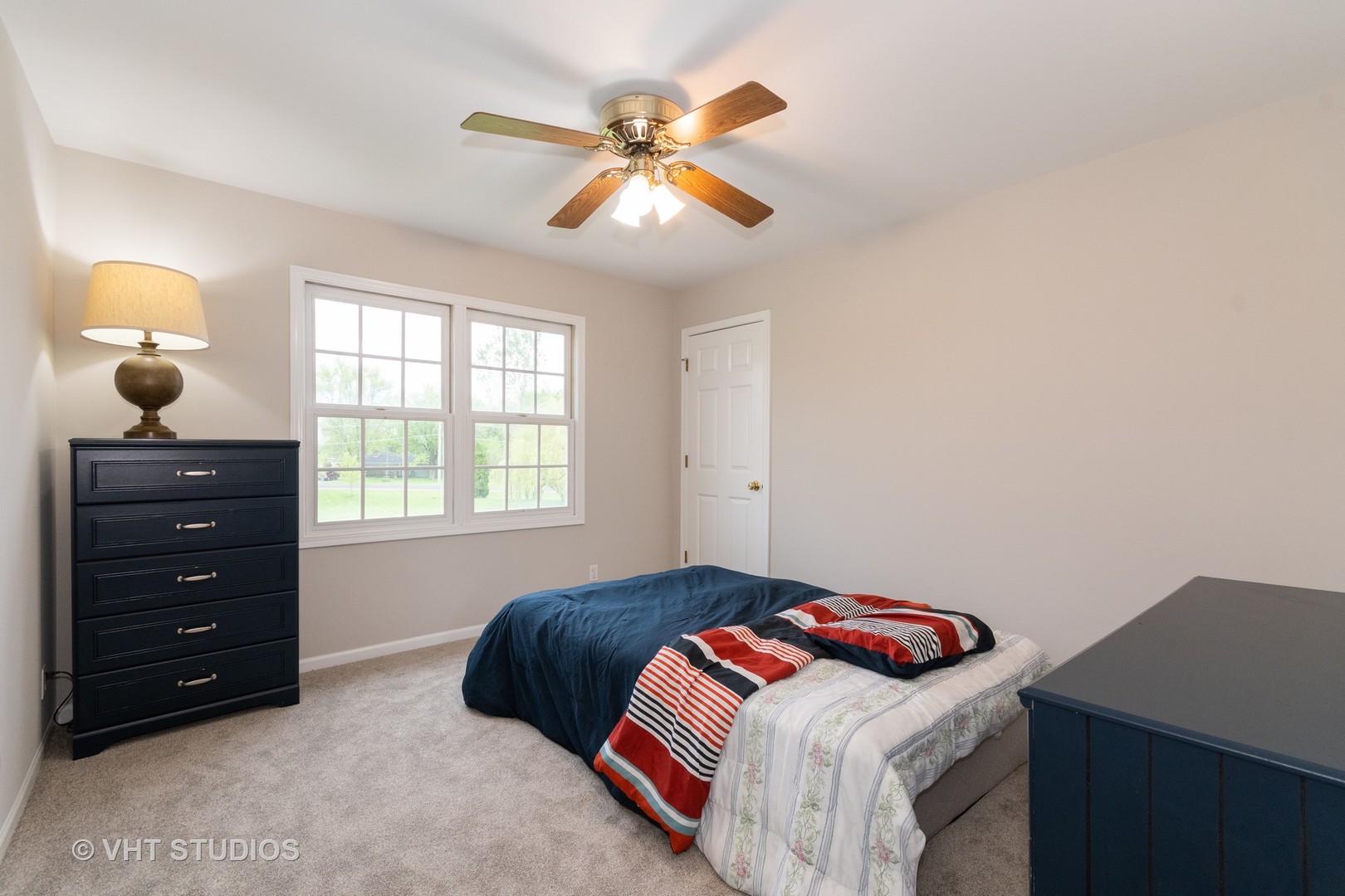 41W910 Verhaeghe Road St. Charles, IL 60175 - Photo 14 of 18 a bedroom with a bed and a chandelier