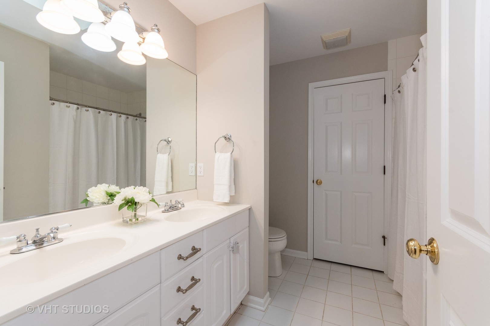 41W910 Verhaeghe Road St. Charles, IL 60175 - Photo 15 of 18 a bathroom with a double vanity sink and a mirror