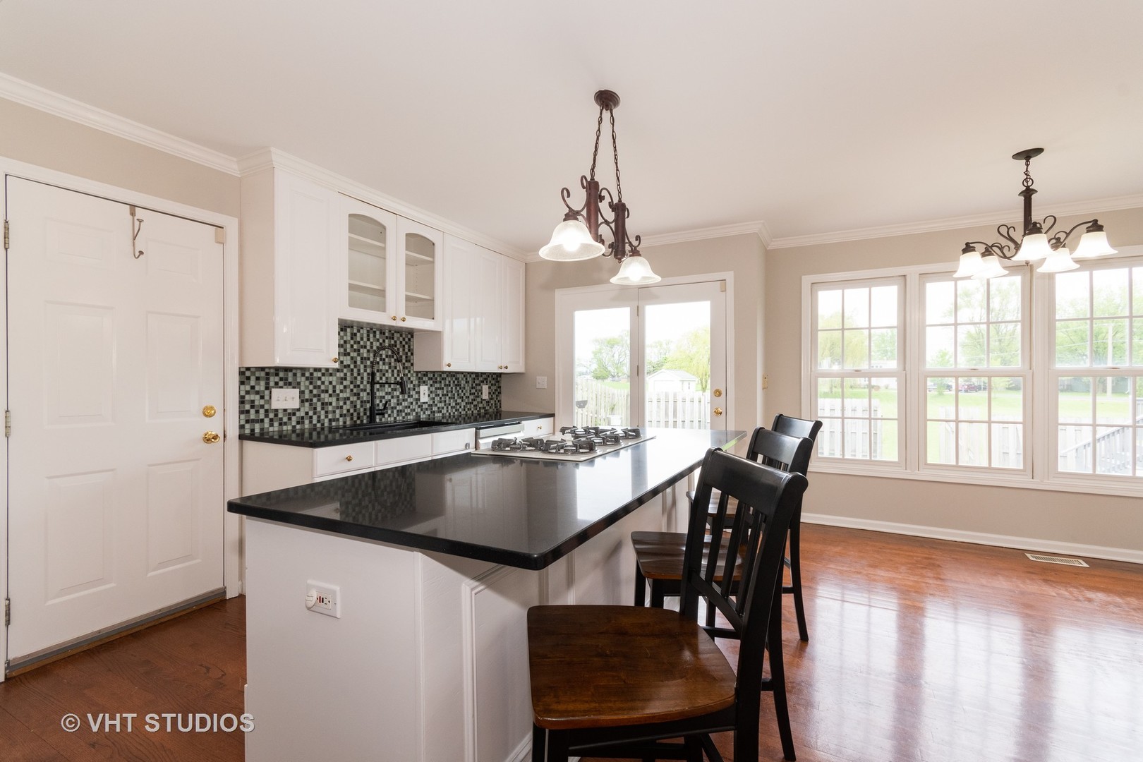 41W910 Verhaeghe Road St. Charles, IL 60175 - Photo 3 of 18 a kitchen with a table chairs and chandelier