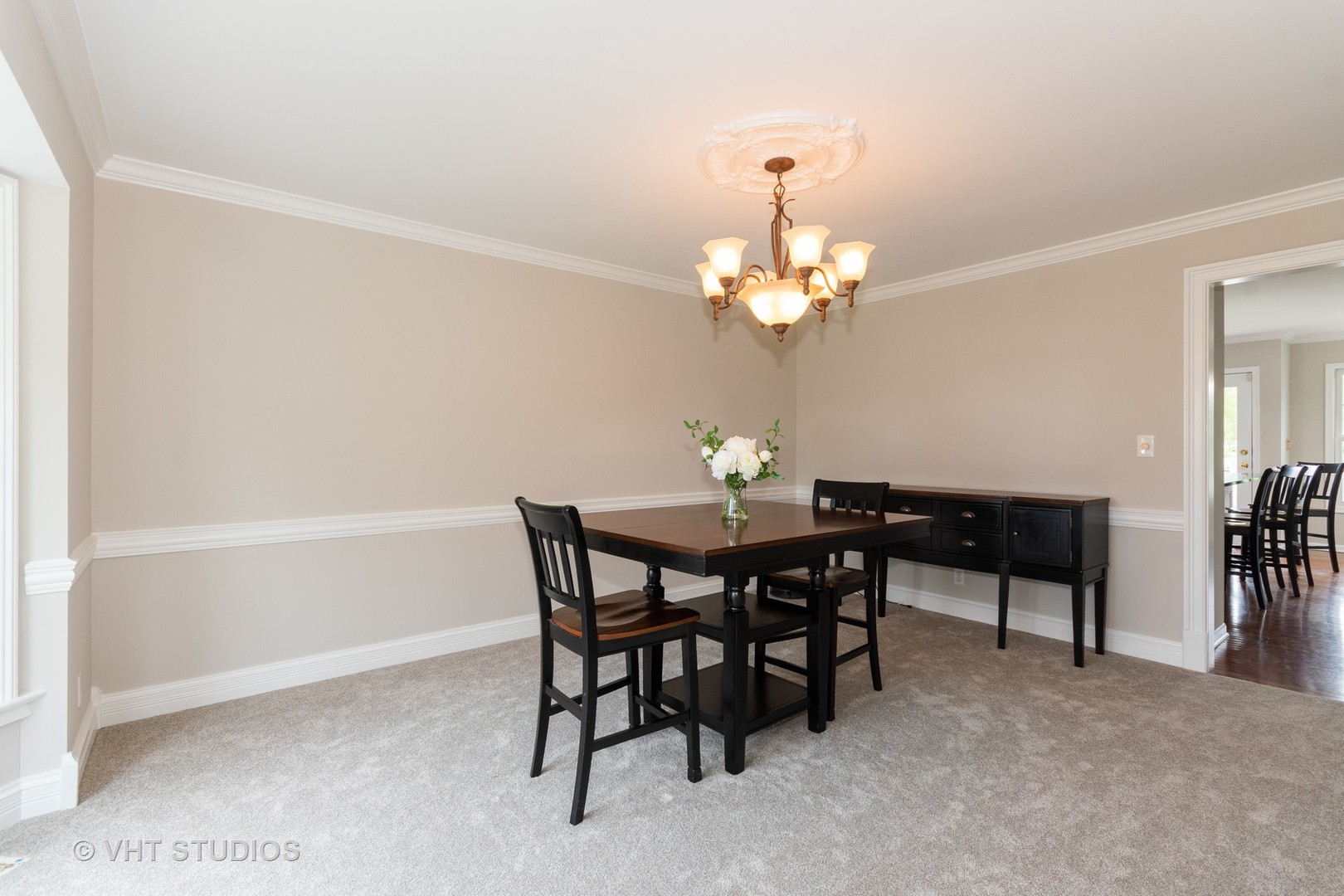 41W910 Verhaeghe Road St. Charles, IL 60175 - Photo 6 of 18 a view of a dining room with furniture and chandelier