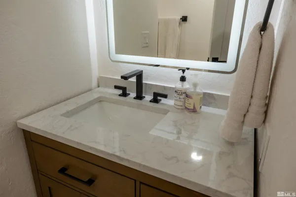 a bathroom with a sink and toilet