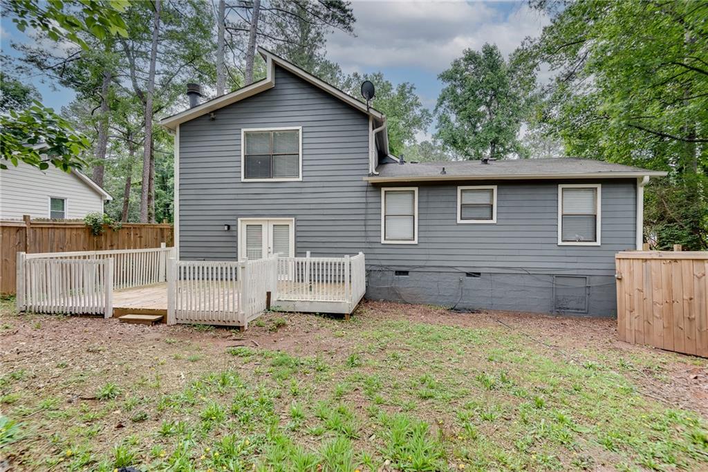 5611 Whittondale Road Lithonia, GA 30058 - Photo 31 of 34 a view of a house with a yard