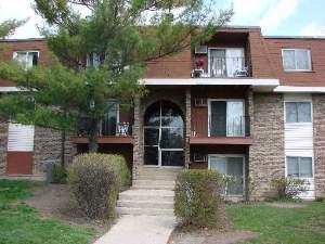 a view of house with outdoor space and trees