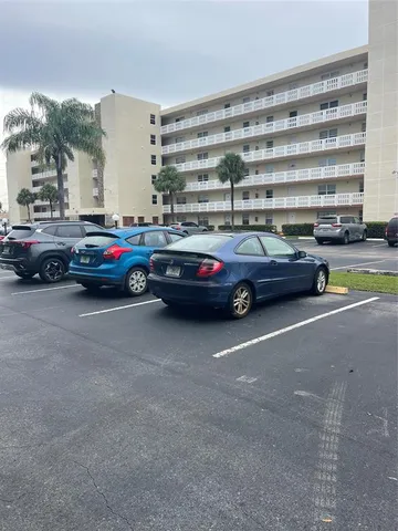 a view of cars parked in a parking lot
