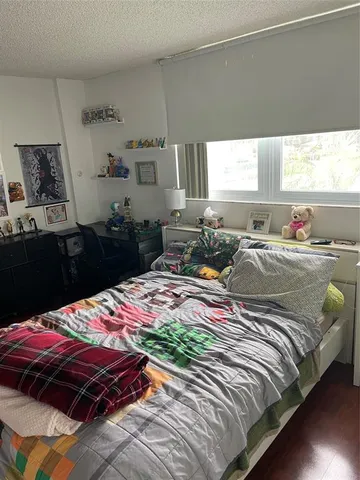 a view of a room with furniture and window