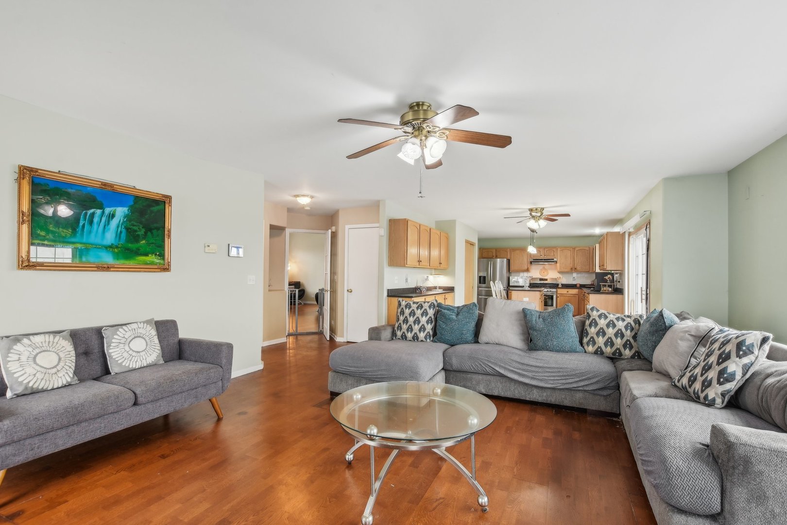 1608 Prairieview Boulevard Bolingbrook, IL 60490 - Photo 12 of 55 a living room with furniture a ceiling fan and a rug