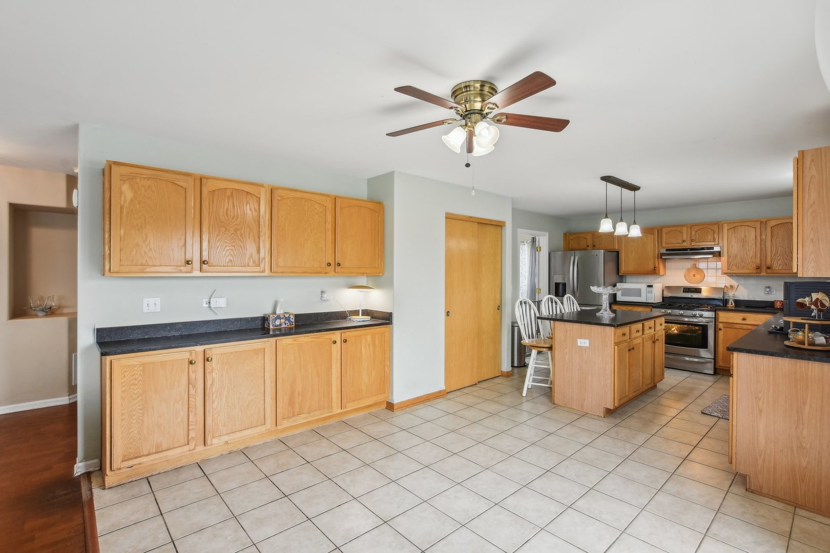 1608 Prairieview Boulevard Bolingbrook, IL 60490 - Photo 13 of 55 a kitchen with stainless steel appliances granite countertop a stove cabinets and sink