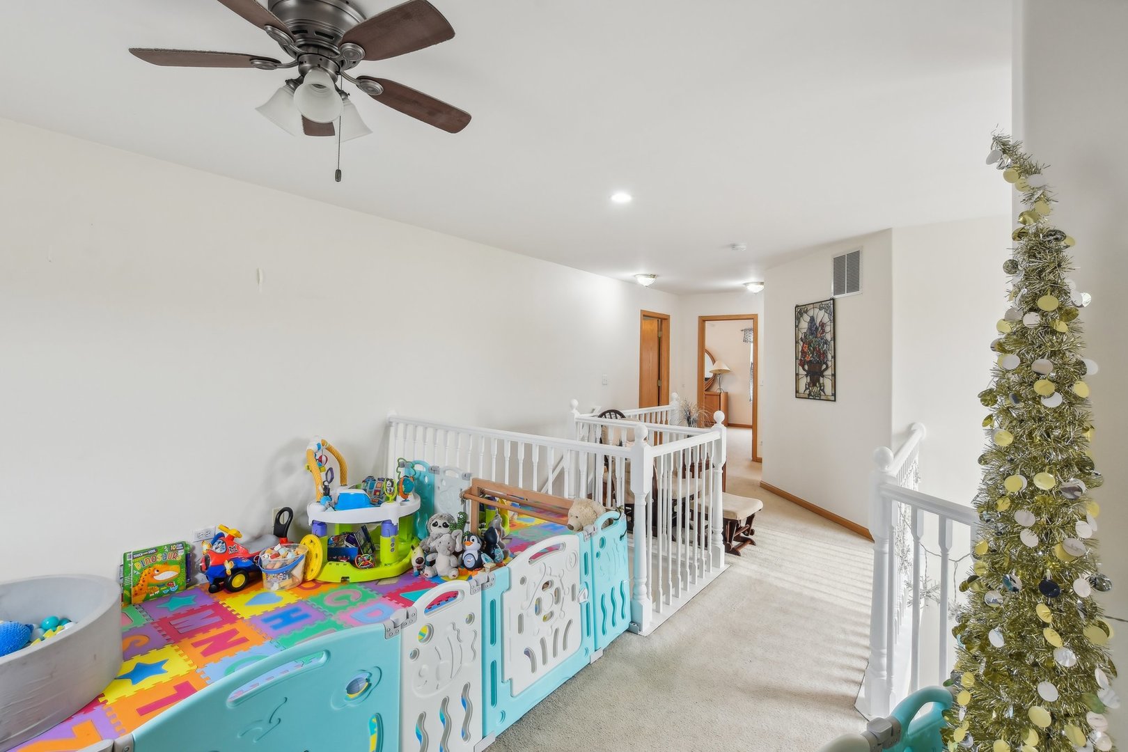 1608 Prairieview Boulevard Bolingbrook, IL 60490 - Photo 23 of 55 a bedroom with furniture a baby crib and a chandelier