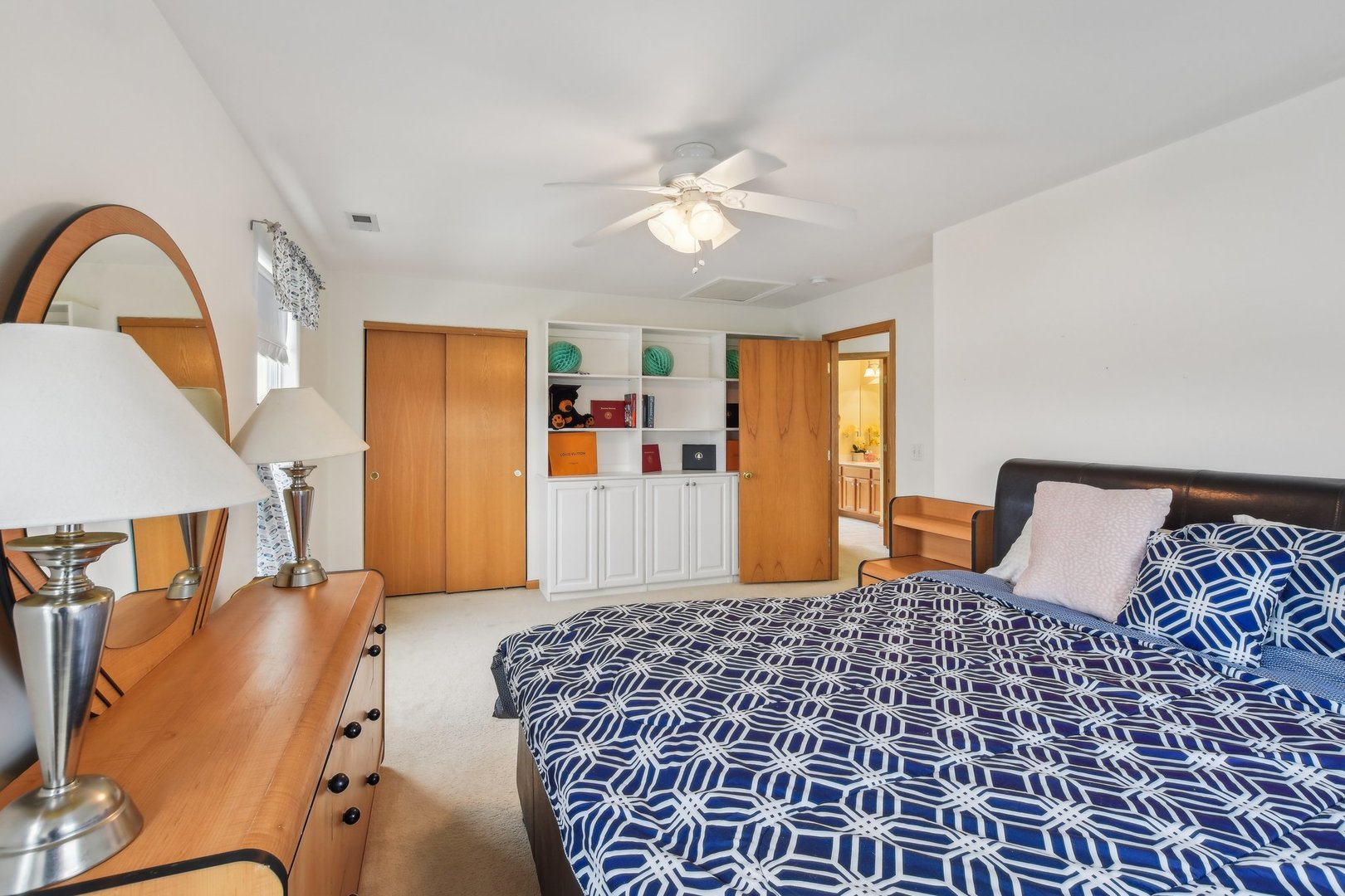 1608 Prairieview Boulevard Bolingbrook, IL 60490 - Photo 31 of 55 a bedroom with a large bed and a dresser