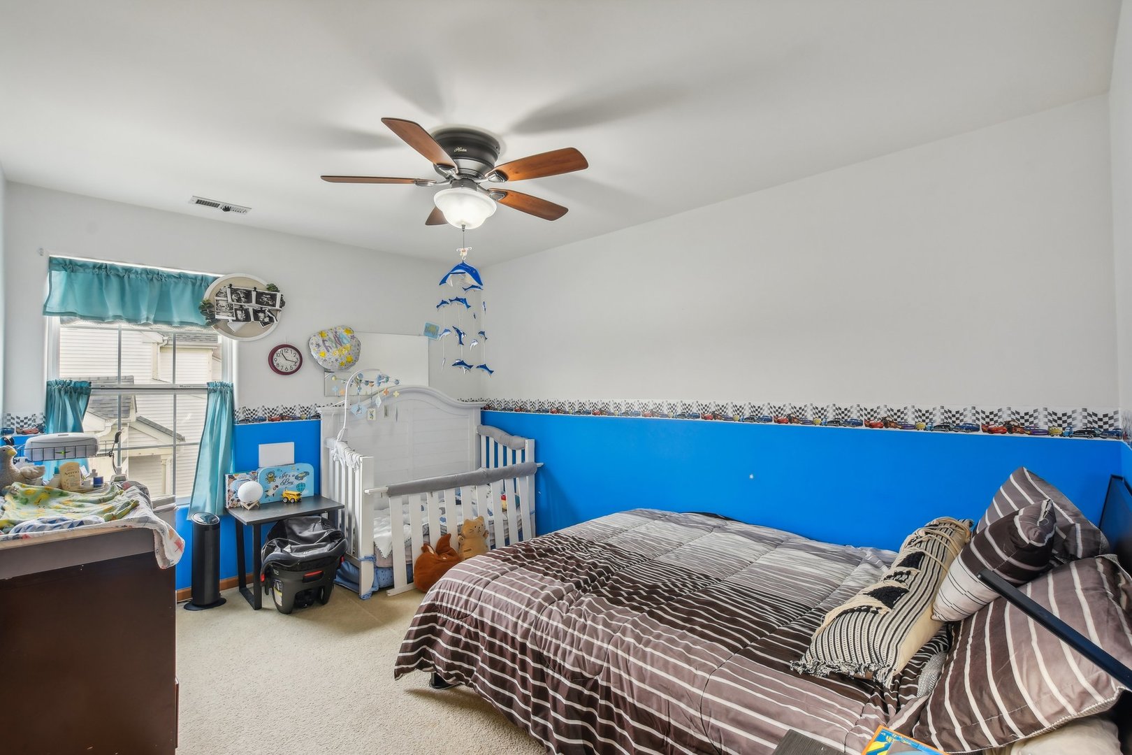 1608 Prairieview Boulevard Bolingbrook, IL 60490 - Photo 32 of 55 a bedroom with a bed and a chandelier