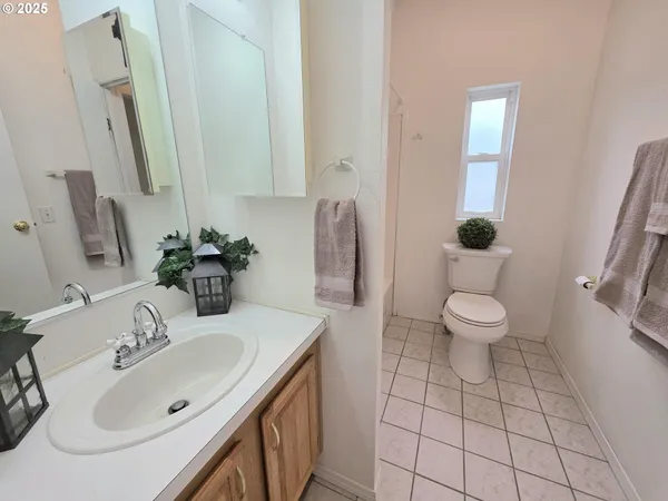 a white toilet sitting next to a bath tub