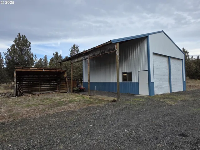 a view of empty room with wooden ceiling