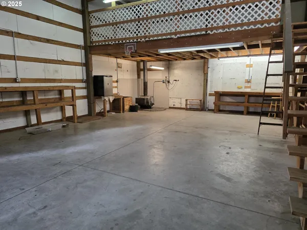 a view of an empty room with gym equipment