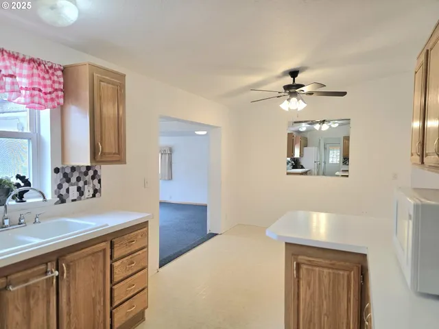 a bathroom with a sink a vanity and a mirror