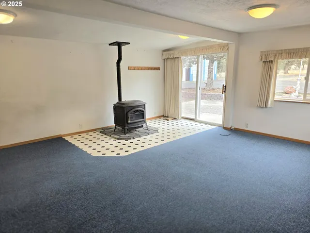 a view of an empty room with windows